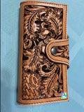 leather clutch with hand tooled Oak leaf and Acorn design. Snap closrue. Bill pockets and 5 card slots. Bucking horse and rider basket stamp