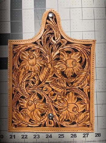 Hand Tooled Daffodil Leather Clutch Wallet Artist: Bill Becker    Snowy Range Leather  Hand Tooled Leather Clutch Wallet  Daffodil flower design  2 pockets - one for bills the other for more bills or a checkbook  4 card slots  Snap closure  Purple interior  7" long x 3 1/2" wide when folded