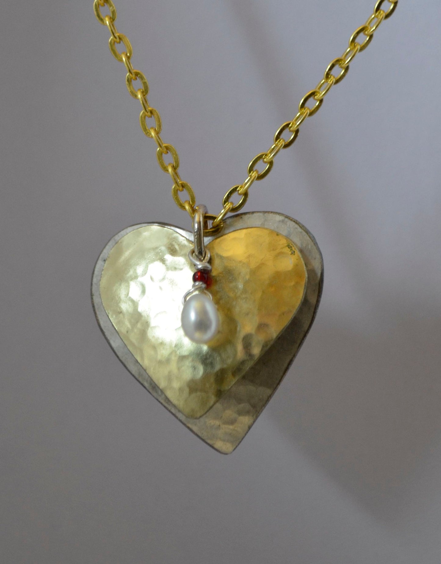 Double Heart Necklace Hearts of Hammered Silver and Brass with Seed Pearl & Ruby Glass Beads
