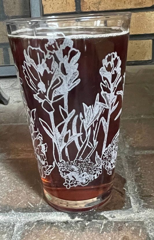Engraved pint glass with a mix of Wyoming WIldflowers