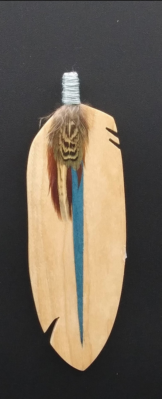 wooden bookmark. Feather shape with a real feather