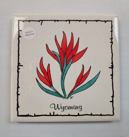 repruposed tile coaster with silk screened and hand painted Indian Paintbrush and the word Wyoming