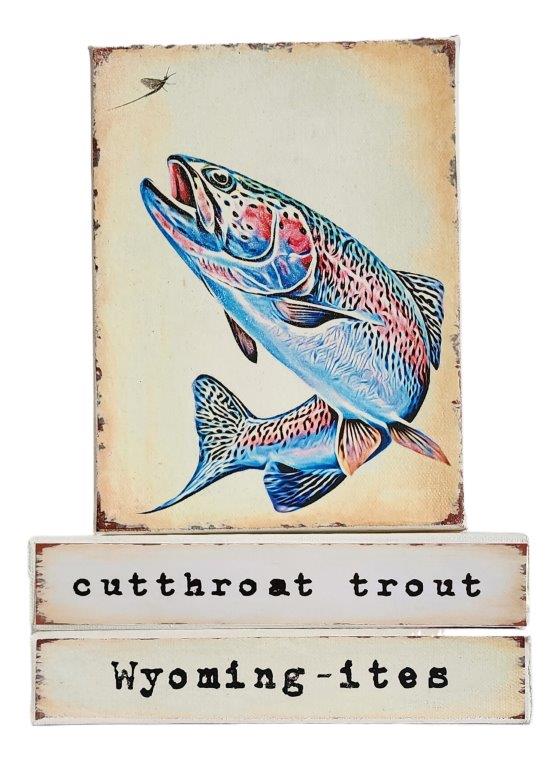 " Cutthroat Trout Wyoming-ites" Canvas Print Artist: Catherine Holt  Print on canvas with wooden framework   Copy from artists original  Colorful Cutthroat trout with small damsel fly in upper left   Cutthroat Trout label on one side and Wyoming-ites label on the other  The Cutthroat is Wyoming's State Fish.  6" long x 8" high x 1 1/2" wide  Signed and numbered by the artist  The cutthroat trout is a fish species of the family Salmonidae.
