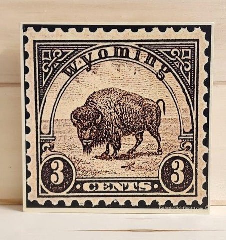 8"x8" wooden board with a vintage 3 cent stamp look. Wyoming and Bison