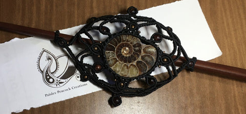 black nylon cord hand kotted macrame hair slide. Includes an ammonite fossil focal with bloodstone beads. wooden stick included