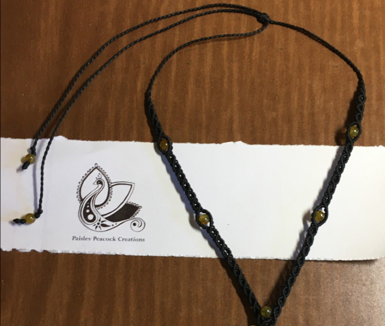 hand knotted black nylon cord with yellow beads
