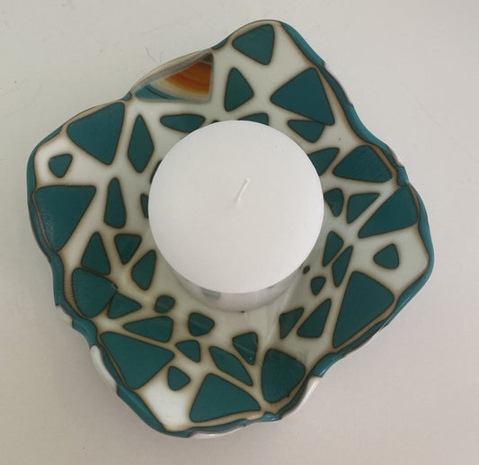 Fused glass dish  Fun shaped white dish  Cream colored with teal triangles with one highlight colored triangle  Use as a candy dish or to hold other small items like a candle  A candle can sit in the dish, or turn dish over and place candle on top                         (when using a candle always place in a safe location, and protect furniture from dripping wax) One candle is included