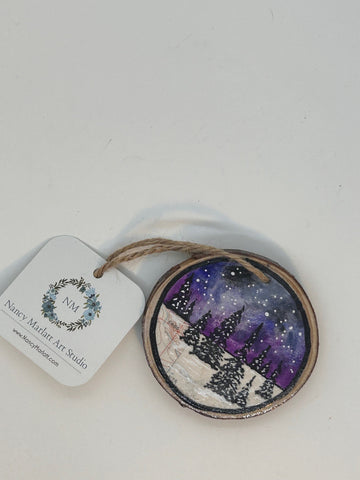 " @6,496 " Hand Painted Wooden Ornament Artist: Nancy Marlatt   Snowy forest landscape with night sky and stars in background  Parts of a topographical map can be seen in the lower left of the landscape  3.5" to 4" Hand Painted round wood slice ornament  Painted with an original mixed water media  Hole with string attached ready for hanging  Title of the artwork piece written on the back  Please note, each art piece is hand created by the Artist , and because of the natural wood slice sizes vary slightly