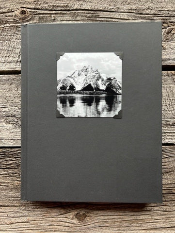 Hardcover black sketchbook  Black and White photograph of Mt. Moran in the Grand Tetons of Wyoming attached to the cover  Blank pages for sketching  Perfect for artists or anyone who likes to sketch  9" long x 11" high x 1 1/4" wide