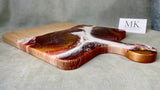 Product Features: Handmade, High Quality, an Original Solid Maple Hardwood Dimensions: 16” L X 10.5” W X .75” H Artistically Crafted Original Resin Artwork by the artist herself Treated with an organic house-made wood conditioner   