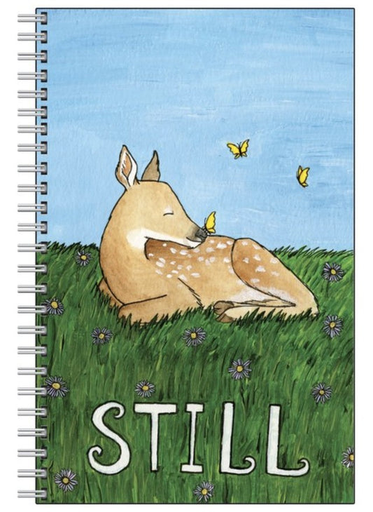 "Still" Notebook Artist:  Tara Pappas Deer laying in a field of grass with butterflies and flowers all around  Spiral Bound notebook with lined pages  8 1/2" x 5 1/2" pages  Would make a wonderful journal