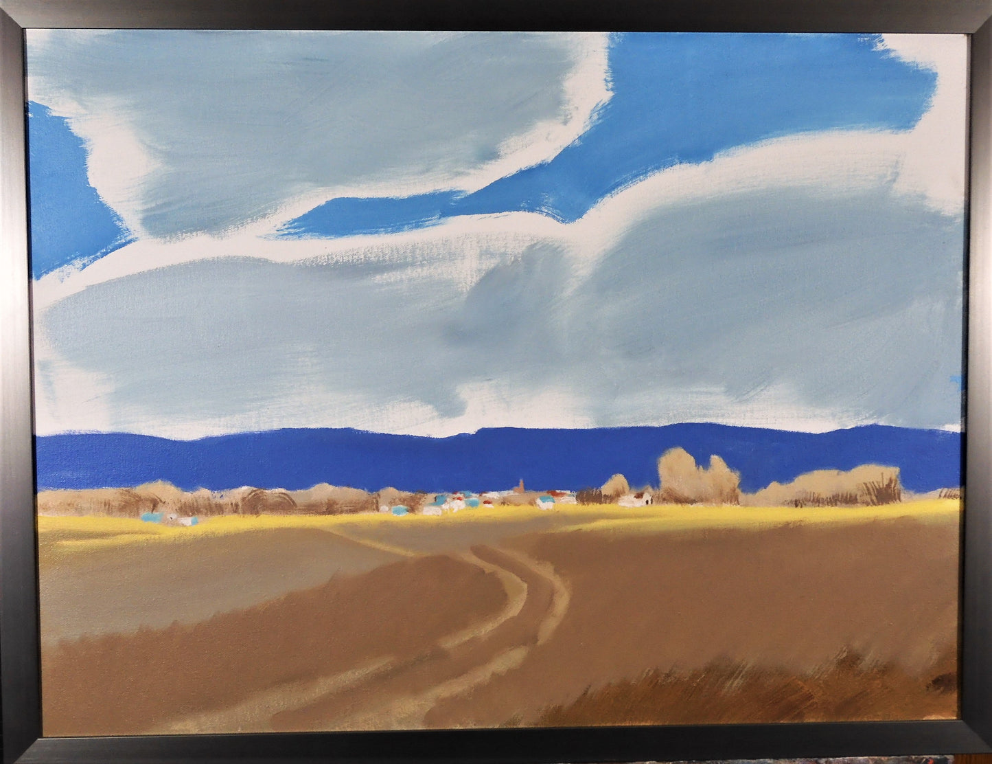 " Almost There " Framed Original Oil Painting Artist: Jon Madsen  Original oil painting  Large clouds above a distant town  24" long x 18" high original oil painting  25" long x 19" high in a dark silver colored frame  D-ring and wire on the back for hanging  Please note item is an original from the artist     From the artist:  Driving home with the sun at my back