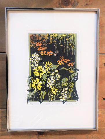 Beautiful garden flowers in yellow, white and peach with green foilage, an original relief print by Ginny Madsen. 16" x 12". White mat and narrow frame
