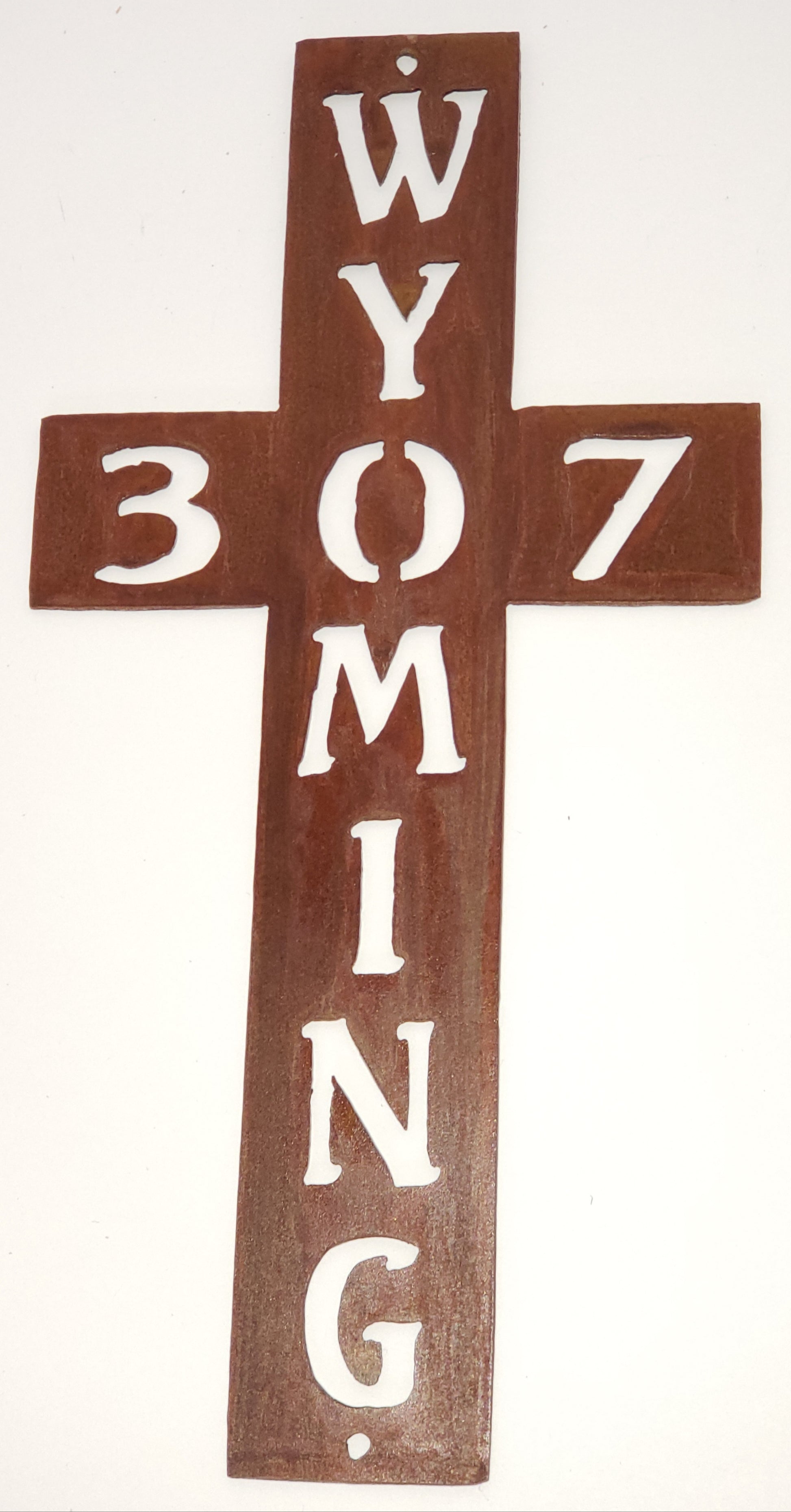 Large metal cross with Wyoming going down the cross and 307 across the cross.  The O and the 0 are used as the same.