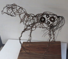 " Happy Appy " Wire Horse Sculpture Artist: Celeste Havener Wire Horse Sculpture  Baling wire bent and sculpted by hand into a wire horse statue  Small pieces of found hardware woven into the sculpture  Base made from Walnut that has been sanded  16" long x 8" wide x 15" high