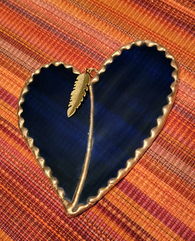 " Medium Blue Waterglass Heart " Stained Glass Suncatcher Artist: Carol Westbrook  L - 5.0 "  W - 4.0 "  2 sections to the teardrop  Copper foil  Stained Glass Sun Catcher  Cord for hanging  Brass feather finding attached to the hanging ring
