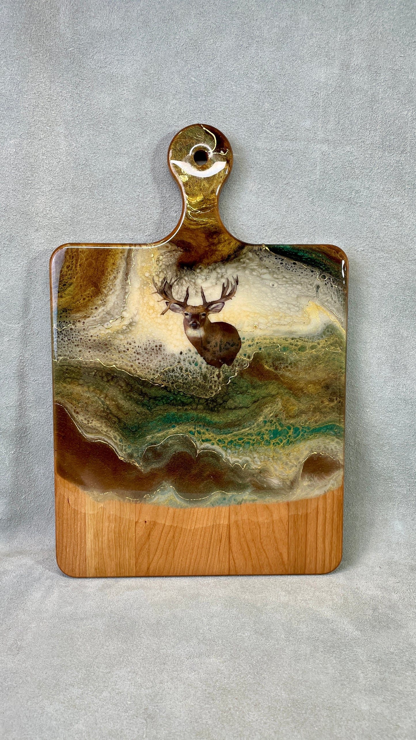Our wood and resin serving boards offer an easy, unique entertaining solution that is ready to impress from big crowds to intimate gatherings for years to come setting the perfect stage for entertaining or gourmet gifts.  The mulie decal  is  highlighted against an ivory resin background with a swirls of the 24K gold accent within the layers of resin