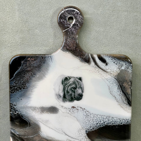 Grizzly Bear Charcuterie Cheese Board Artist: Marcy Knotwell  What matters most at home: beautiful, functional simplicity, and originality. Our wildlife charcuterie serving boards  offer just that as they are absolutely original works of art and are appreciated by collectors for both their originality and  use.