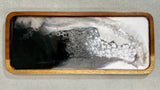 Monochrome, Multipurpose Teak Wood and Resin Tray Artist: Marcy Knotwell Rivers of contrast with bubbles in black, white, and grays  What matters most at home: beautiful, functional simplicity, and originality. Our artisanal charcuterie cheese serving boards offer just that as they are absolutely original works of art and are appreciated by collectors for both their originality and use.