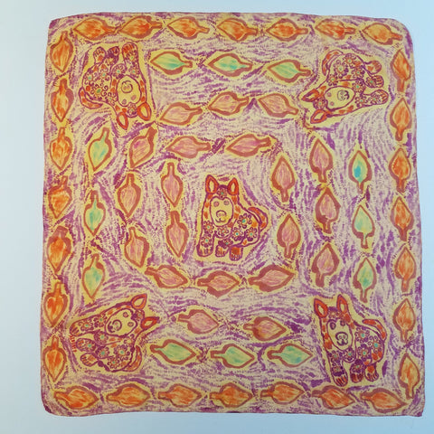 5 puppies painted in the Paruvian style.  One in the center and one in each corner.  Leaf pattern in spirals around the shawl