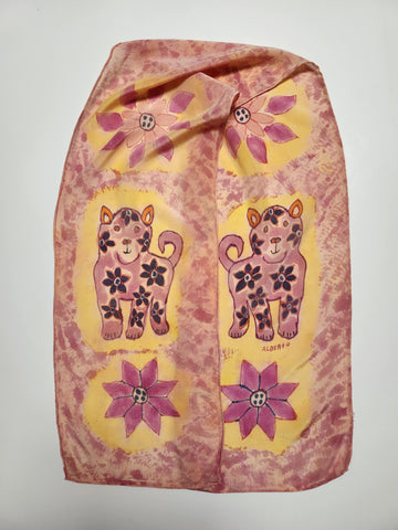 " Rooster " Peruvian Art Crepe De Chine Silk Scarf Artist: Alberto Alcantara  11" x 58" silk scarf  Hand painted and hand dyed  Orange, purple, pink, yellow  Puppy design  Bright multi colored flowers  Wonderful scarf for completing a fun outfit