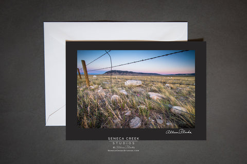 barbed wire fence on the plains near Centennial Wyoming. blank card with envelope