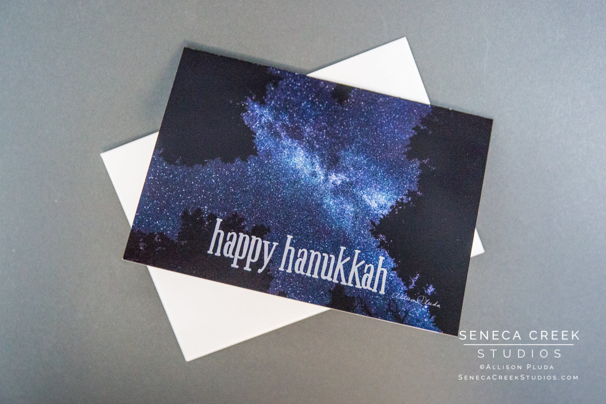Happy Hanukkah blank card. Photograph of the Milky Way in a dark Wyoming night sky