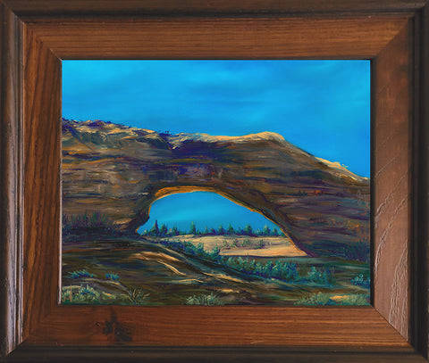 "Arc De Triomphe" Framed Reproduction Giclee Print Artist: Melonie Jones  Beautiful arch against a deep blue sky with a grassy background   13" Long  X  11 1/2" Wide  X  1" Deep  Rustic frame with brown accents   Would look great on the wall or on an easel on the fire place  Please note, each  piece is custom designed by the Artist , with a slight variation between each piece