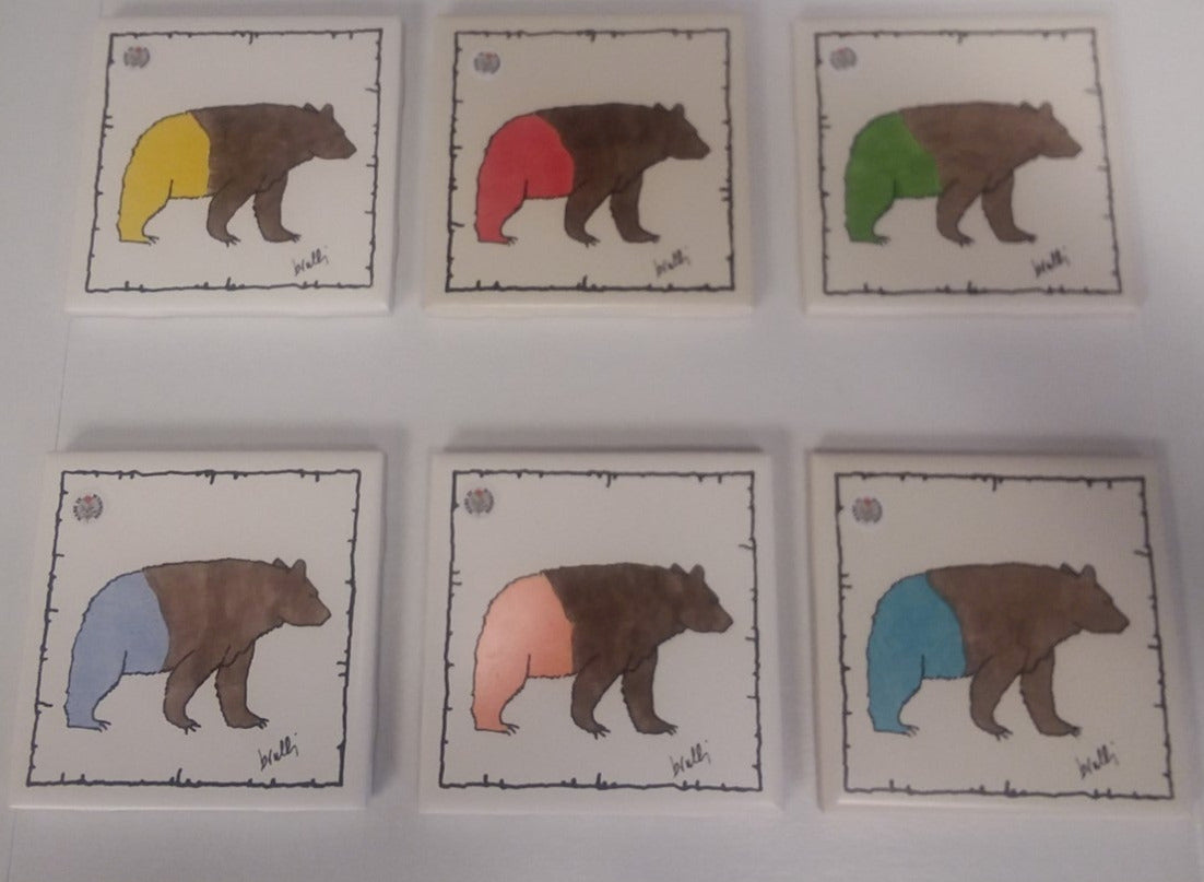 various colors of screen printed bear on the coaster. hand painted