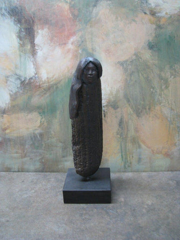 stone and bronze statue of a native woman