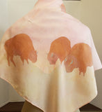 29 inch by 29 inch silk shawl. hand painted with bison. light pink and yellow background