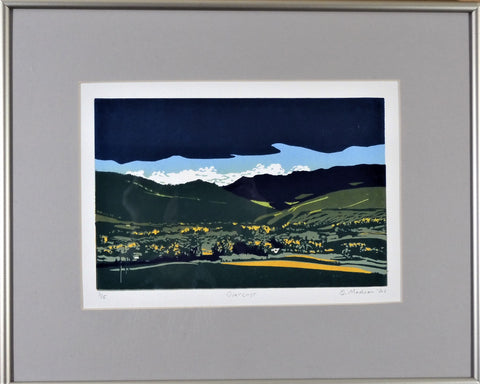 "Overcast" Framed Relief Print Artist: Ginnie Madsen  Framed  Gray and white Mat  Narrow silver frame  Dark sky with lighter sky and clouds overcasting the mountains and green valleys  6" wide x 9" long x 1" deep print only  12" wide  x 15" long x 1" deep framed only  Relief print  Please note, each relief is custom designed by the Artist , with a slight variation between each relief print