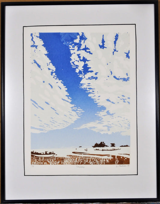 " Skyway " Framed Original Relief Print Artist: Ginnie Madsen  Wyoming skies, especially with summer clouds, seem so large when one drives across open country.   2 1/2" white matting around the relief print  9" long x 12" high relief print only  15" long x 18" high x 1" deep in sleek dark blue gray metal frame  Wire attached to back of frame for hanging  Original Relief print