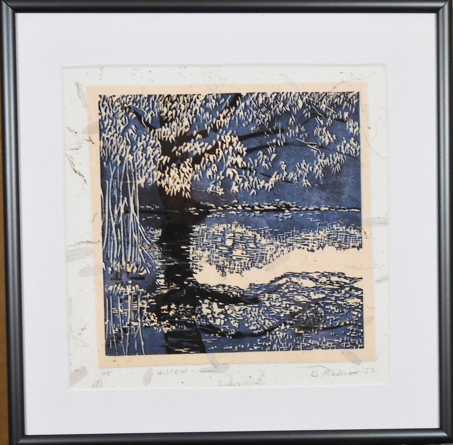 " Willow" and it's Reflection Relief Print Artist: Ginny Madsen  Willow  2022 print  Willow  - This image is based on a willow tree near a pond.   I thought the print looked like a Fall scene  I  printed it  on a textured paper that included leaves.  6" x 6" x 1 .5" Relief print  Matted  10" x 10" approximate framed size  Metal Frame