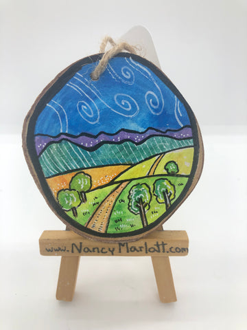 " Over The Hills " Original Wood Slice Ornament. The dirt road taking you to the mountains in the distance