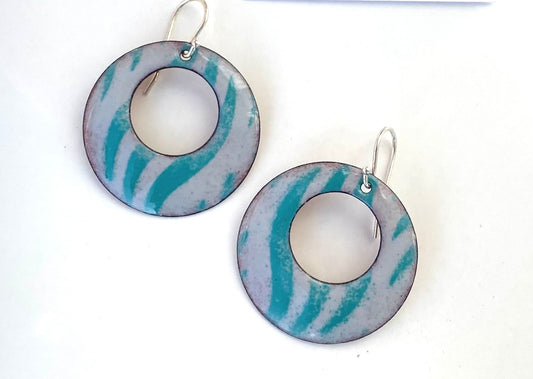 Gray With Green Zebra Pattern Enamel Earrings Jewelry Artist: Kristie Brown Green Zebra design on a pale gray background  Hoop shape enamel earrings  1 1/2" across  Sterling Silver ear wires   Please note, each piece is custom designed by the Artist , with a slight variation between each piece