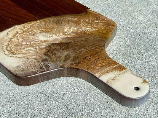 Artisan Charcuterie Cheese Board Artist: Marcy Knotwell  Ivory, brown with liquid gold lacing resin designs  "You will not be disappointed with the quality of this product! Our handcrafted wood-grain edge charcuterie cheese boards are the answer to stylish, multi-functional, sustainable serve-ware.  When not in use, this charcuterie cheese board makes a beautiful addition to your countertop or gallery wall.