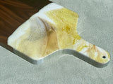 White, Gold and Yellow  You will not be disappointed with the quality of this product! Our handcrafted wood- grain edge Charcuterie Cheese Board Platter are the answer to stylish, multi- functional, sustainable serveware. When not in use, this charcuterie cheese board makes a beautiful addition to your countertop or gallery wall
