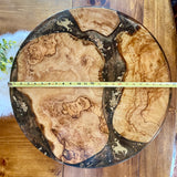 The western designed 24” x 24” x 1” piece is an original work of art  Features three stunning slabs of olive wood:       * carved from a single piece of wood       * fitted together with brown and gold food-safe epoxy resin       *  liquid gold  ,     * mica chips        *a touch of gold leaf resulting in an incredible warm variation         of color, design and shape   