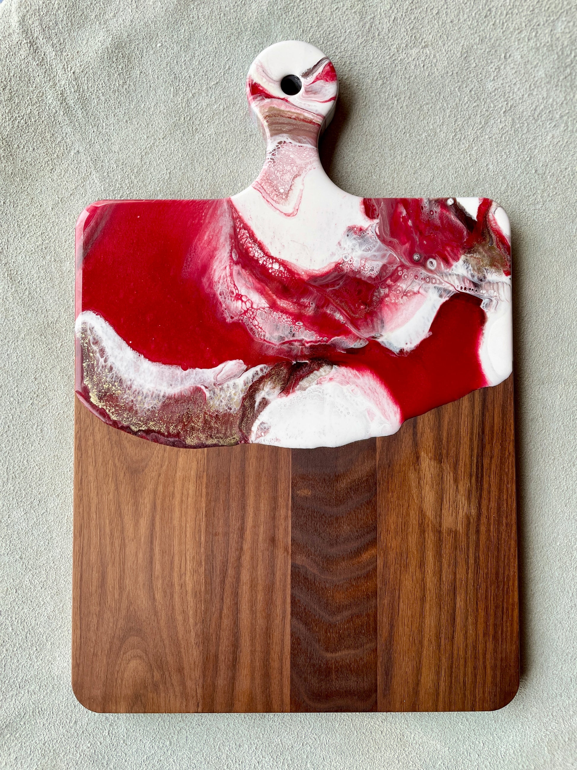 Red, white and gold resin on a walnut charcuterie cheese board
