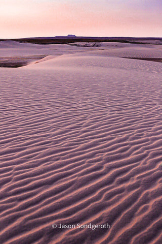 Sunrise at Table Mountain in the Red Desert, Wyoming by photographer, Jason SondgerothNorth Table Mountain Sunrise, Red Desert Jason Sondgeroth, Artist  Photograph  Ready for a frame of your choice  Table Mountain in the background  12" X 8"  Card stock for support  Clear, plastic sleeve for protection  Near Alta, Wyoming  Table Mountain's summit sits along the border between Jedediah Smith Wilderness and Grand Teton National Park  This is a very popular area for backpacking, camping, and hiking,