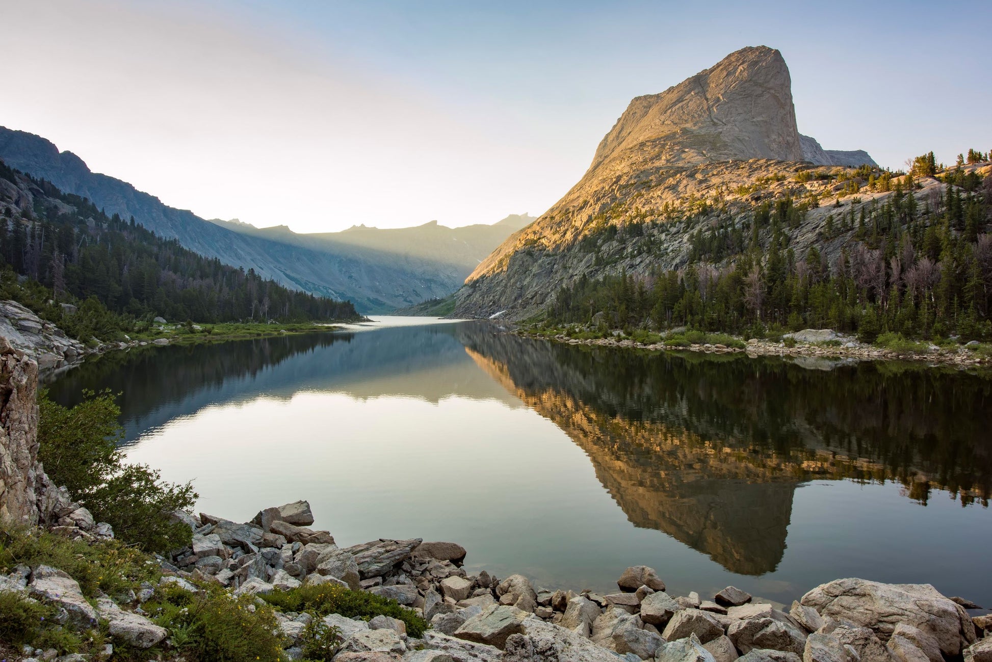" Black Joe Lake " Photographer: Kyle Spradley 8 " x 10" Lustre Print  Horizontal print  Alpenglow during a morning at Black Joe lake  Calm waters  Back country camping destination, high in the Wind River Mountains  Wyoming  Reflections in the lake  A protective sleeve is provided along with black mat for stability  Ready for a frame of  your choice