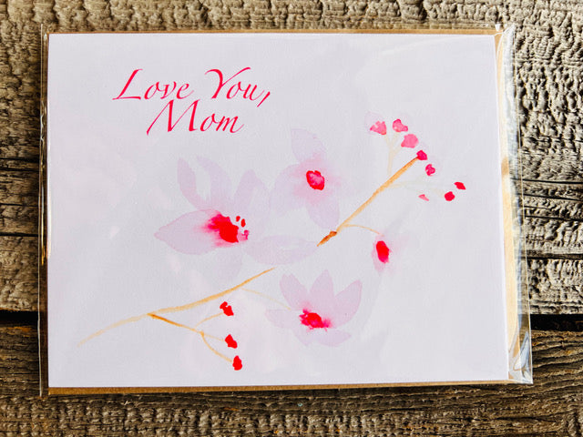 <h1>" Love You, Mom " Greeting Card</h1> <h2>Artist: Lisa Edwards</h2> <p data-mce-fragment="1">From an original watercolor painting by the artist<br data-mce-fragment="1"></p> <p data-mce-fragment="1">Love You, Mom with Cherry Blossoms<br data-mce-fragment="1"></p> <p data-mce-fragment="1">Blank Card with Kraft envelope included for each card<br data-mce-fragment="1"></p> <p data-mce-fragment="1">5 1/2" long x 4 1/4" wide</p> <strong>Single Card</strong><br>&nbsp; 