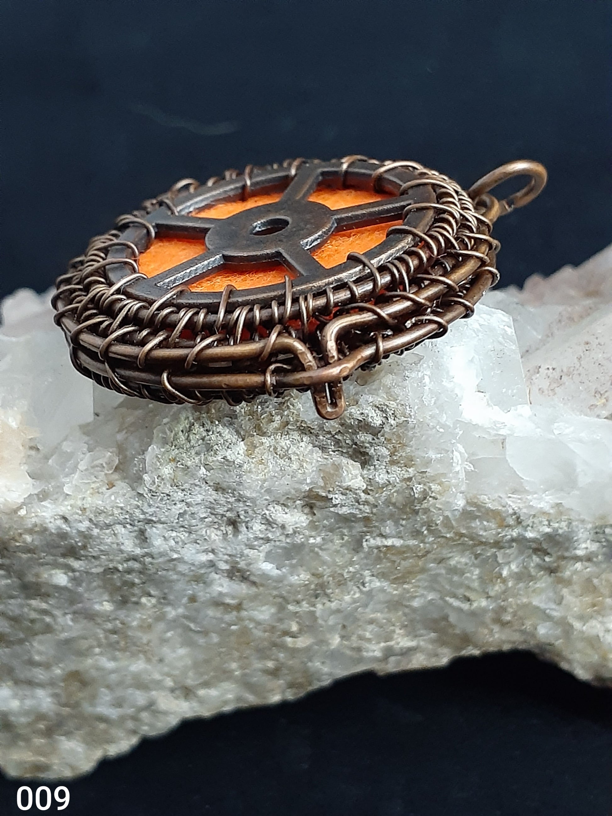 Wired Wrapped Essential Oil Locket Necklace  Artist: Lindsey Griffin  Wired Wrapped Essential Oil Locket Necklace   1 7/16" long x&nbsp; 1 7/16" wide   Extra Felt pads for other Oils and&nbsp; Copper Wire Wrapped   Nice necklace piece for any neckline   Please note Items are handmade by Artist