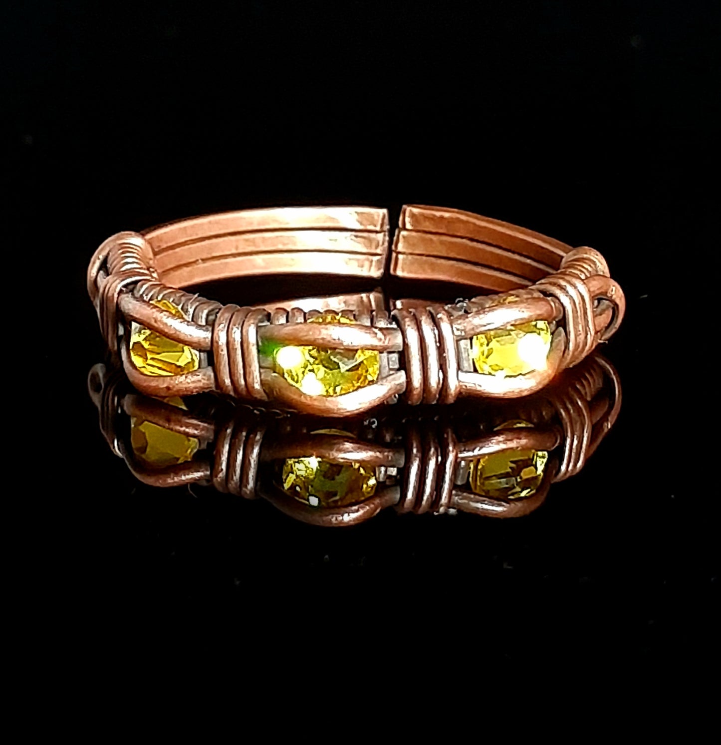 Size 8 oxidized copper wire with 3 yellow high quality crystals. ring has slight adjustment