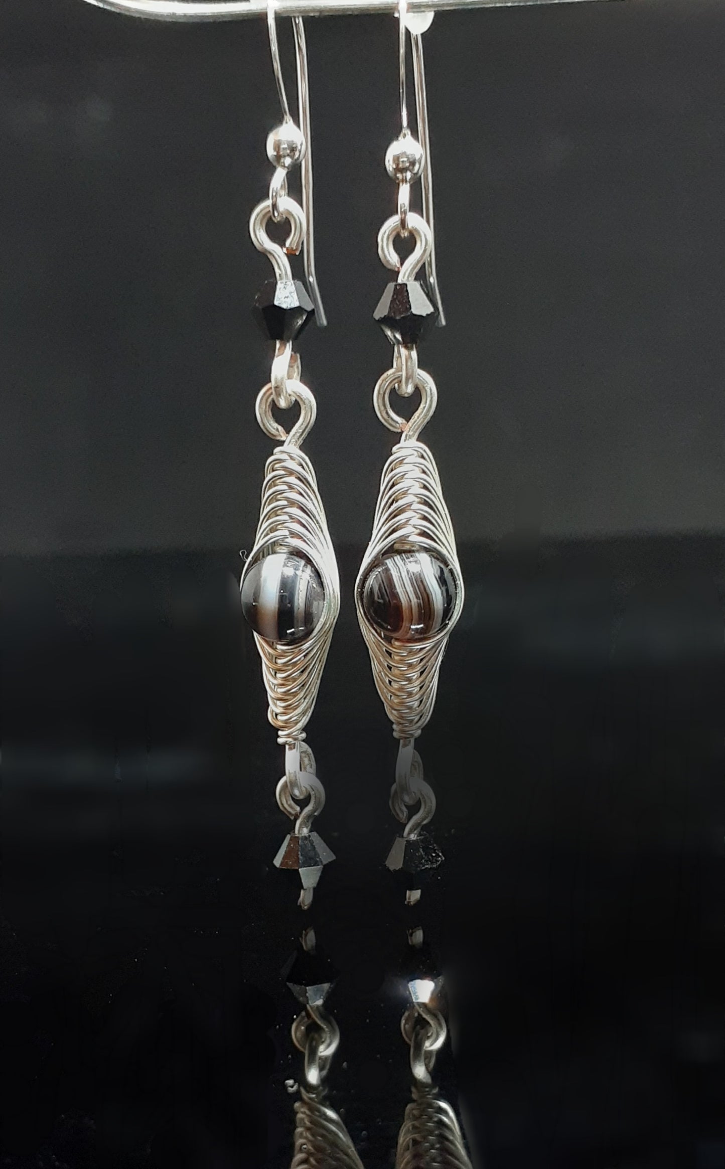 Botswana Agate wrapped in silver wire with Swarovski crystals. Sterling Silver ear wires