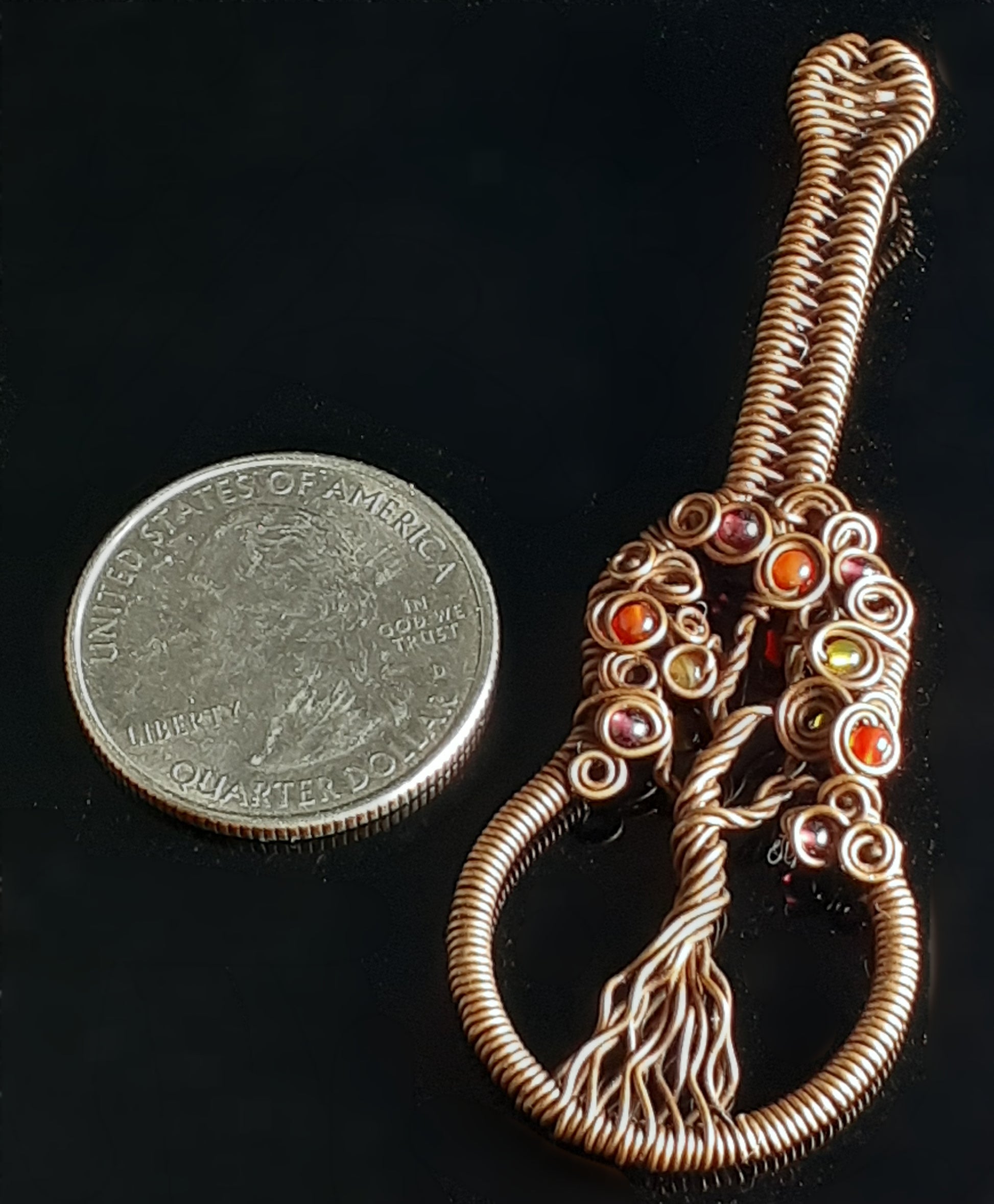 Autumn Colored Tree Of Life Guitar Pendent  Artist: Lindsey Griffin   Agate beads in Autumn colors wrapped in oxidized copper   Guitar shaped with wrapped wire and agate beads.  Leather cord to wear as a necklace  2 7/8" Long x 1" Wide x 1/4" Deep   Care instructions and polishing cloth included  A beautiful delicate necklace for everyday use
