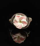 Pink Plumeria Copper Ring Artist: Lindsey Griffin  Polymer clay shaped into a Plumeria flower  Ring is in oxidized copper  Size 5.5  Care instructions with polishing cloth included  Please note Items are handmade and there is a slight variation between each piece