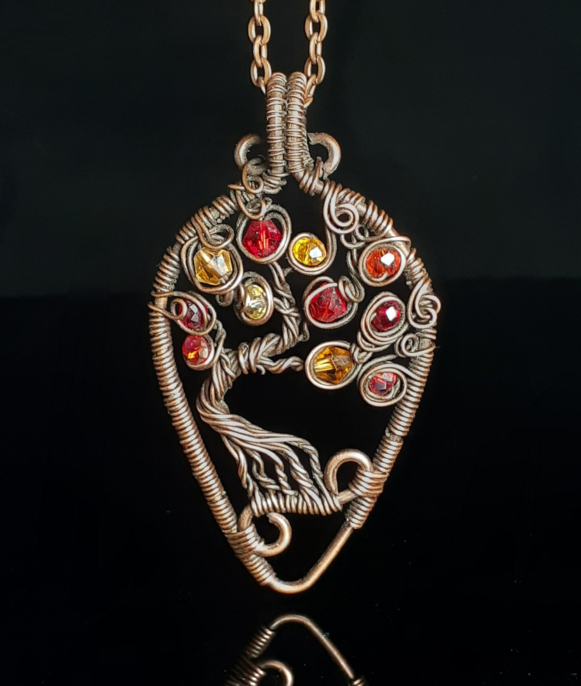 Autumn Leaf Tree of Life Pendant Artist: Lindsey Griffin Swarovski beads in   oxidized copper  2.25" x 1.0"
