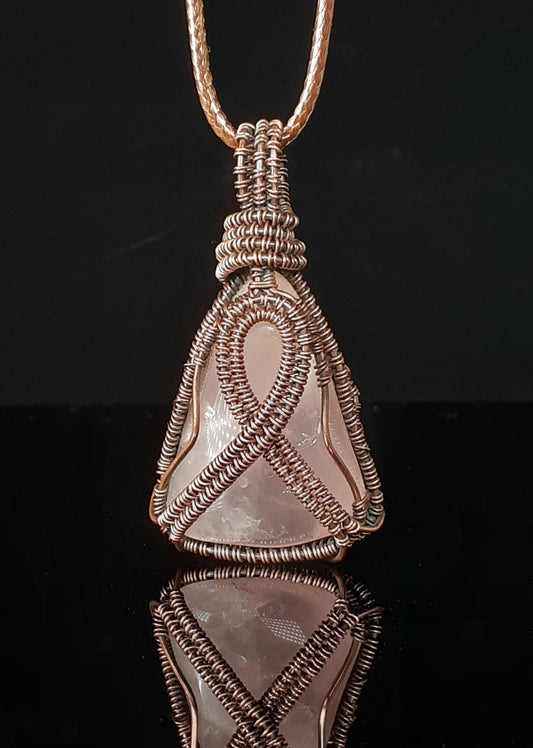 Rocky Mountain Rose Quartz in oxidized polished copper.  Hand wrapped in oxidized polished copper wire.  Breast Cancer Ribbon emblem 